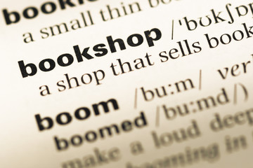 Close up of old English dictionary page with word bookshop