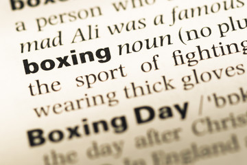 Close up of old English dictionary page with word boxing
