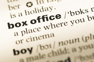 Obraz premium Close up of old English dictionary page with word box office