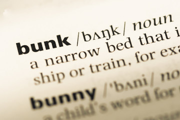 Fototapeta premium Close up of old English dictionary page with word bunk