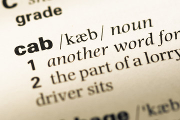 Close up of old English dictionary page with word cab