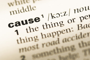 Close up of old English dictionary page with word cause