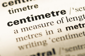 Obraz premium Close up of old English dictionary page with word centimetre