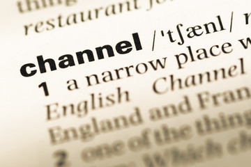 Fototapeta premium Close up of old English dictionary page with word channel