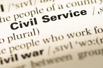 Close up of old English dictionary page with word civil service