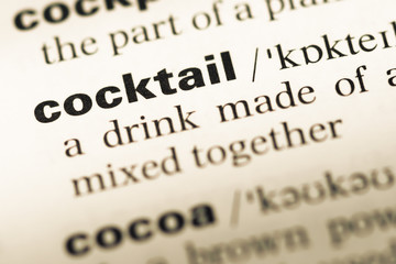 Close up of old English dictionary page with word cocktail