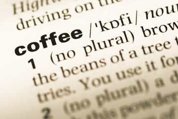 Obraz premium Close up of old English dictionary page with word coffee