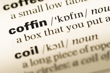Obraz premium Close up of old English dictionary page with word coffin