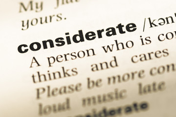 Obraz premium Close up of old English dictionary page with word considerate