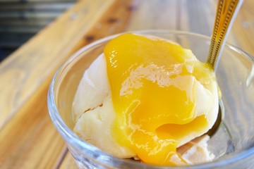 Mango ice cream with fresh mango sauce