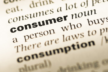 Obraz premium Close up of old English dictionary page with word consumer