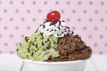 pistachio and chocolate ice cream in white bowl