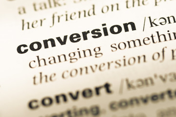 Obraz premium Close up of old English dictionary page with word conversion