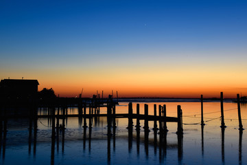 Fototapeta na wymiar Sunset over frozen lagoon in Harvey Cedars, Long Beach Island