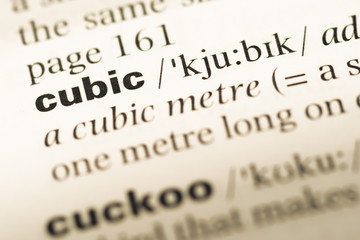 Obraz premium Close up of old English dictionary page with word cubic