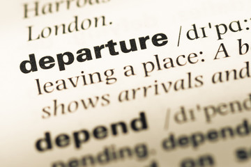 Obraz premium Close up of old English dictionary page with word departure