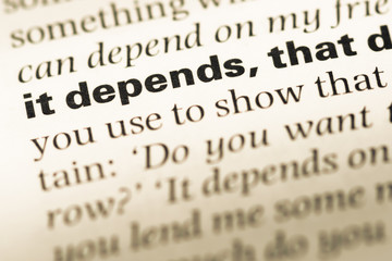 Fototapeta premium Close up of old English dictionary page with word it depends