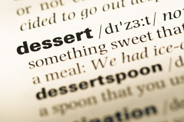 Obraz premium Close up of old English dictionary page with word dessert