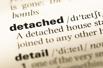 Close up of old English dictionary page with word detached