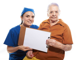 young intern with old patient showing clipboard