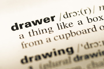 Fototapeta premium Close up of old English dictionary page with word drawer