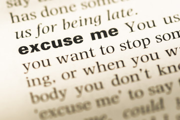 Fototapeta premium Close up of old English dictionary page with word excuse me