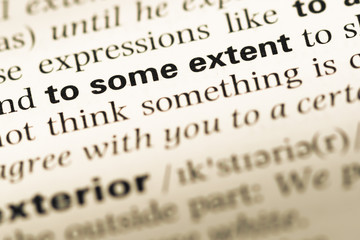 Close up of old English dictionary page with word to some extent