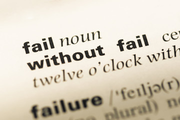 Close up of old English dictionary page with word fail