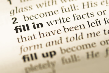 Close up of old English dictionary page with word fill in