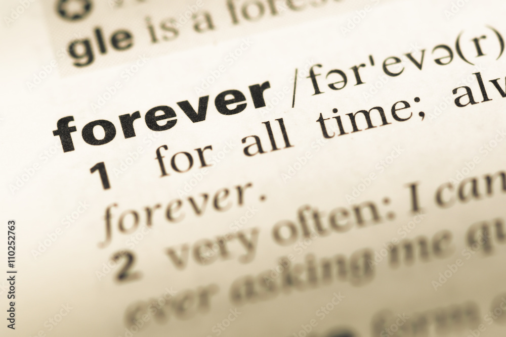 Wall mural close up of old english dictionary page with word forever