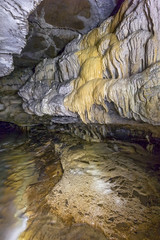 Intricate and colorful flow stone formations adorn Indian's Port Cave.