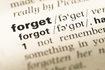 Fototapeta premium Close up of old English dictionary page with word forget