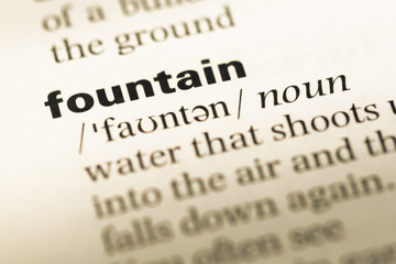 Close up of old English dictionary page with word fountain