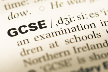 Close up of old English dictionary page with word GCSE