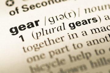 Obraz premium Close up of old English dictionary page with word gear