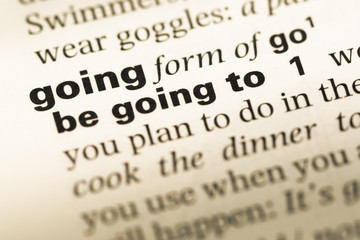 Obraz premium Close up of old English dictionary page with word going