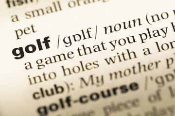 Obraz premium Close up of old English dictionary page with word golf
