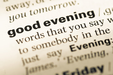 Close up of old English dictionary page with word good evening