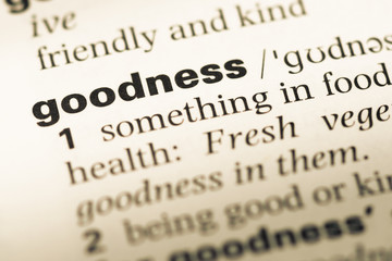 Close up of old English dictionary page with word goodness