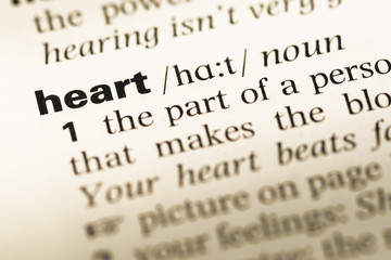 Fototapeta premium Close up of old English dictionary page with word heart
