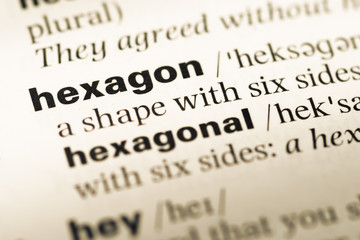 Fototapeta premium Close up of old English dictionary page with word hexagon
