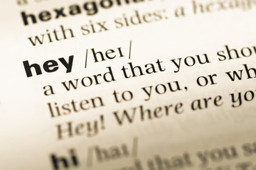 Close up of old English dictionary page with word hey