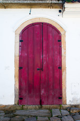 Typical historical colourful wood doors in the colonial downtown of Paraty, Rio de Janeiro, Brazil.