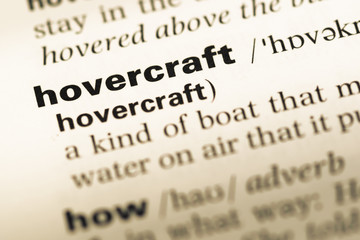 Close up of old English dictionary page with word hovercraft