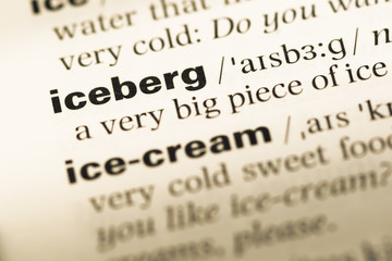 Close up of old English dictionary page with word iceberg