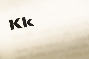 Close up of old English dictionary page with word k