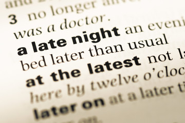 Obraz premium Close up of old English dictionary page with word a late night