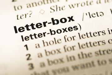 Fototapeta premium Close up of old English dictionary page with word letter box