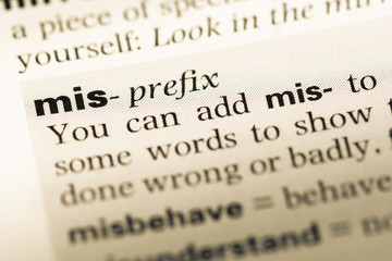 Close up of old English dictionary page with word mis © TungCheung