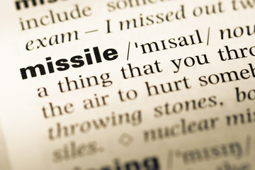 Fototapeta premium Close up of old English dictionary page with word missile